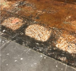Metal raised access flooring adhesive contamination